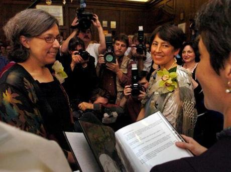 Newton’s justice of the peace Gayle Smalley read the marriage vows for Maureen Brodoff  (left) and Ellen Wade. 
